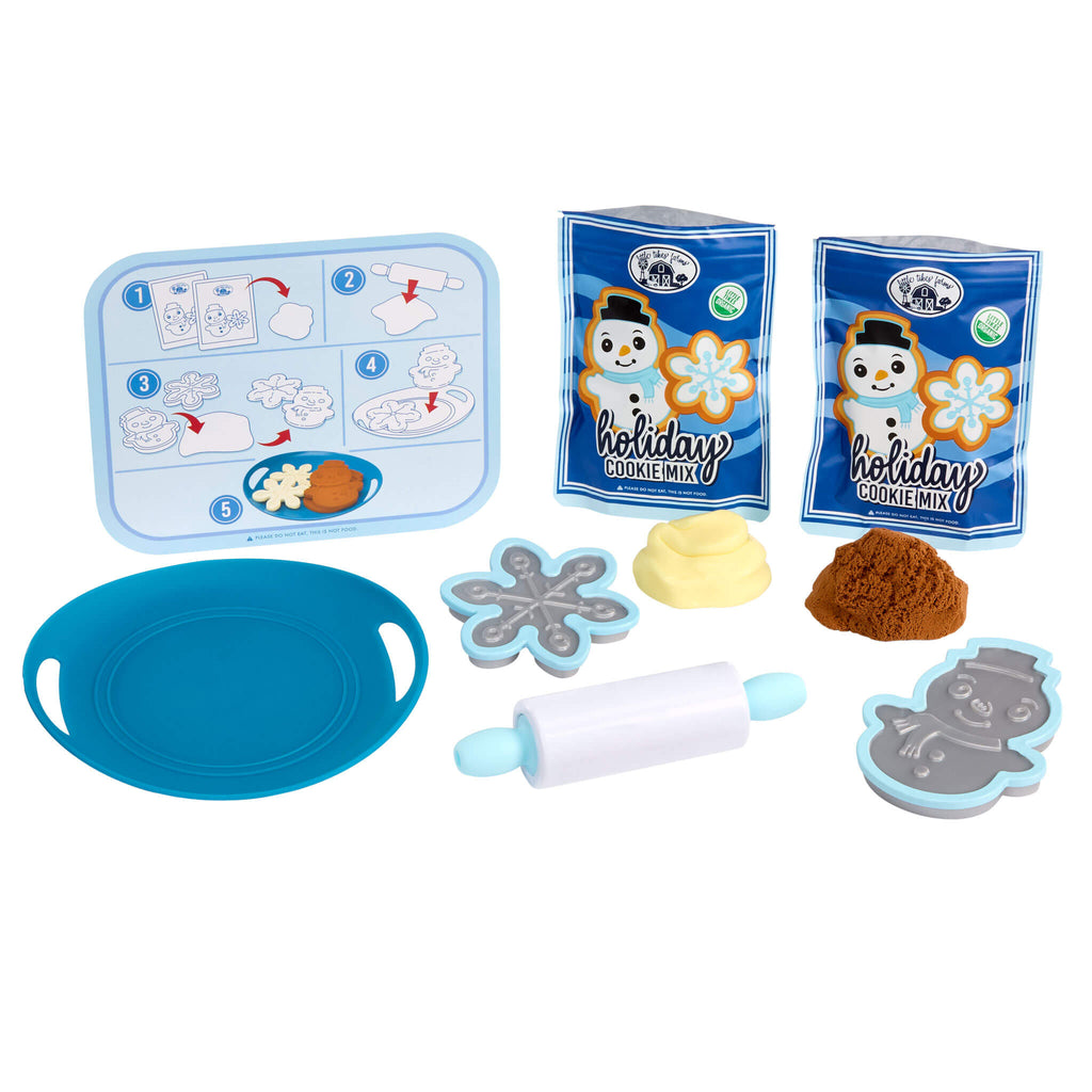 Toy baking set with cookie mix, tools, and a recipe card on a white background